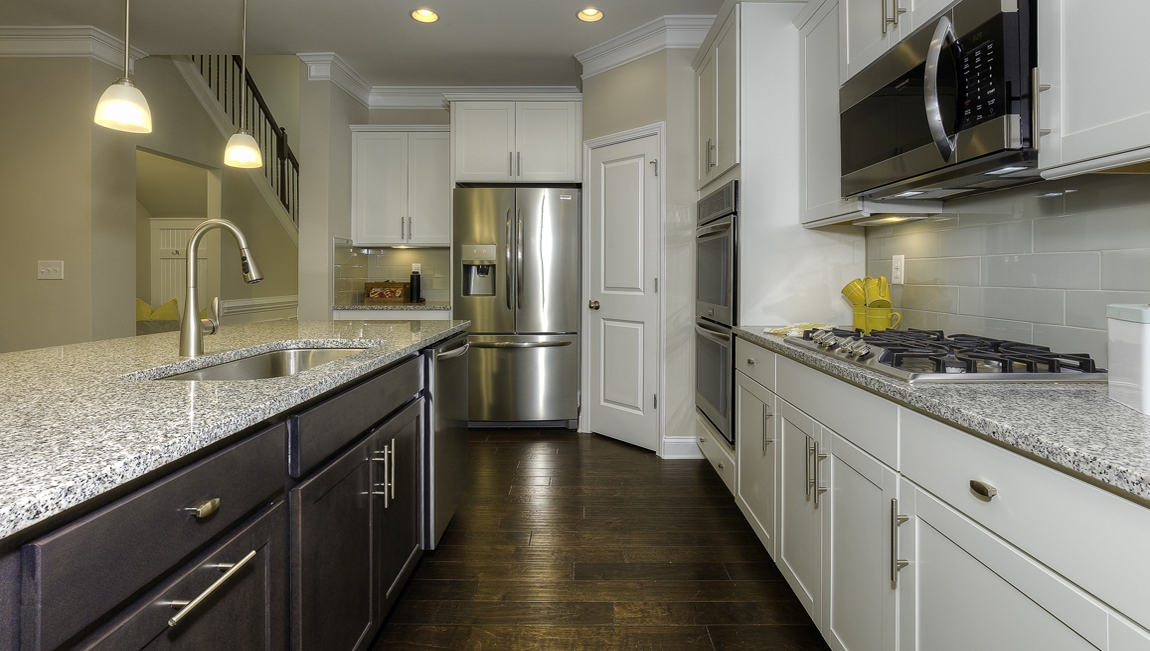 Kitchen and island with white cabinets