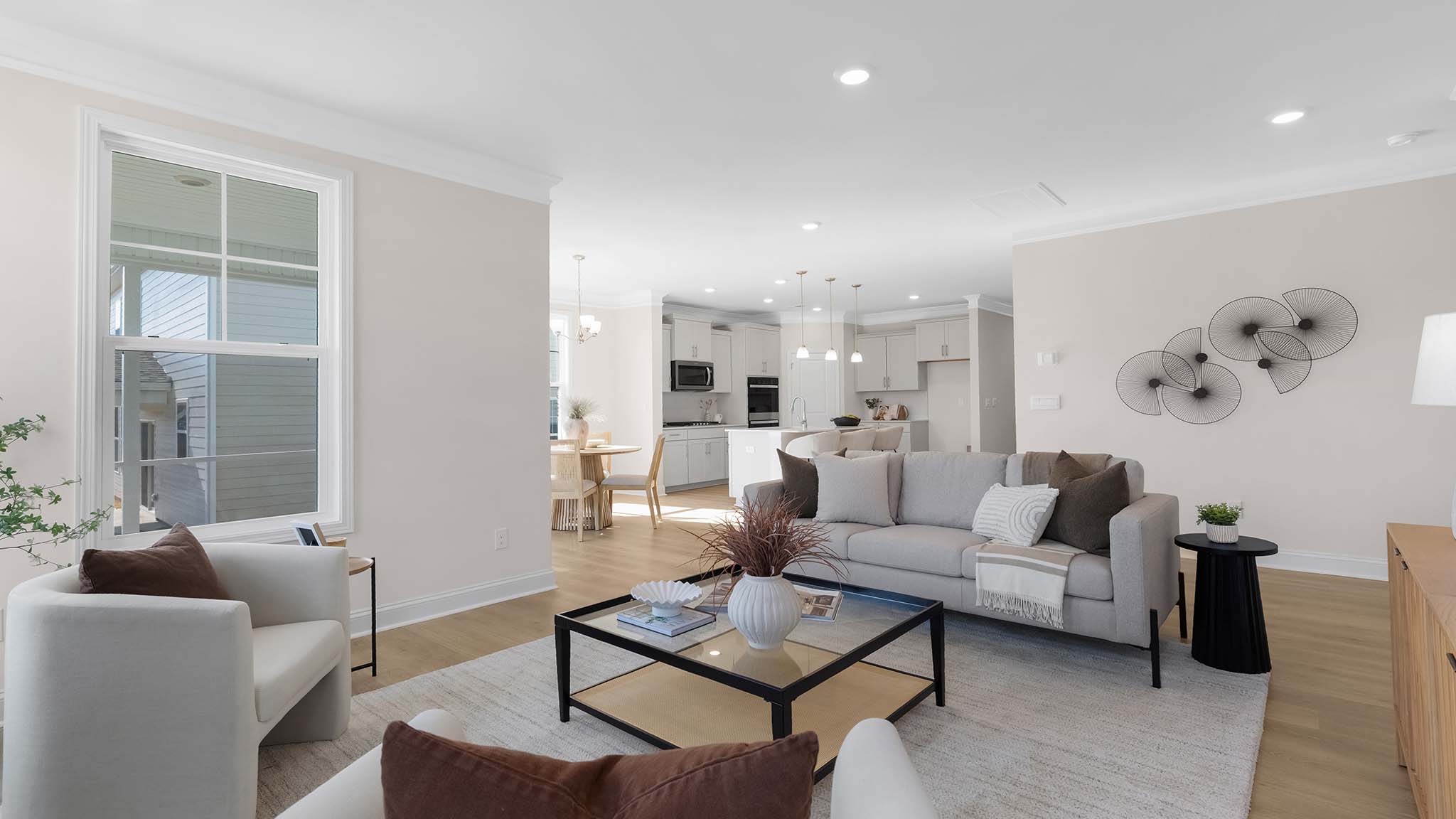 Open family room with two large window and fireplace