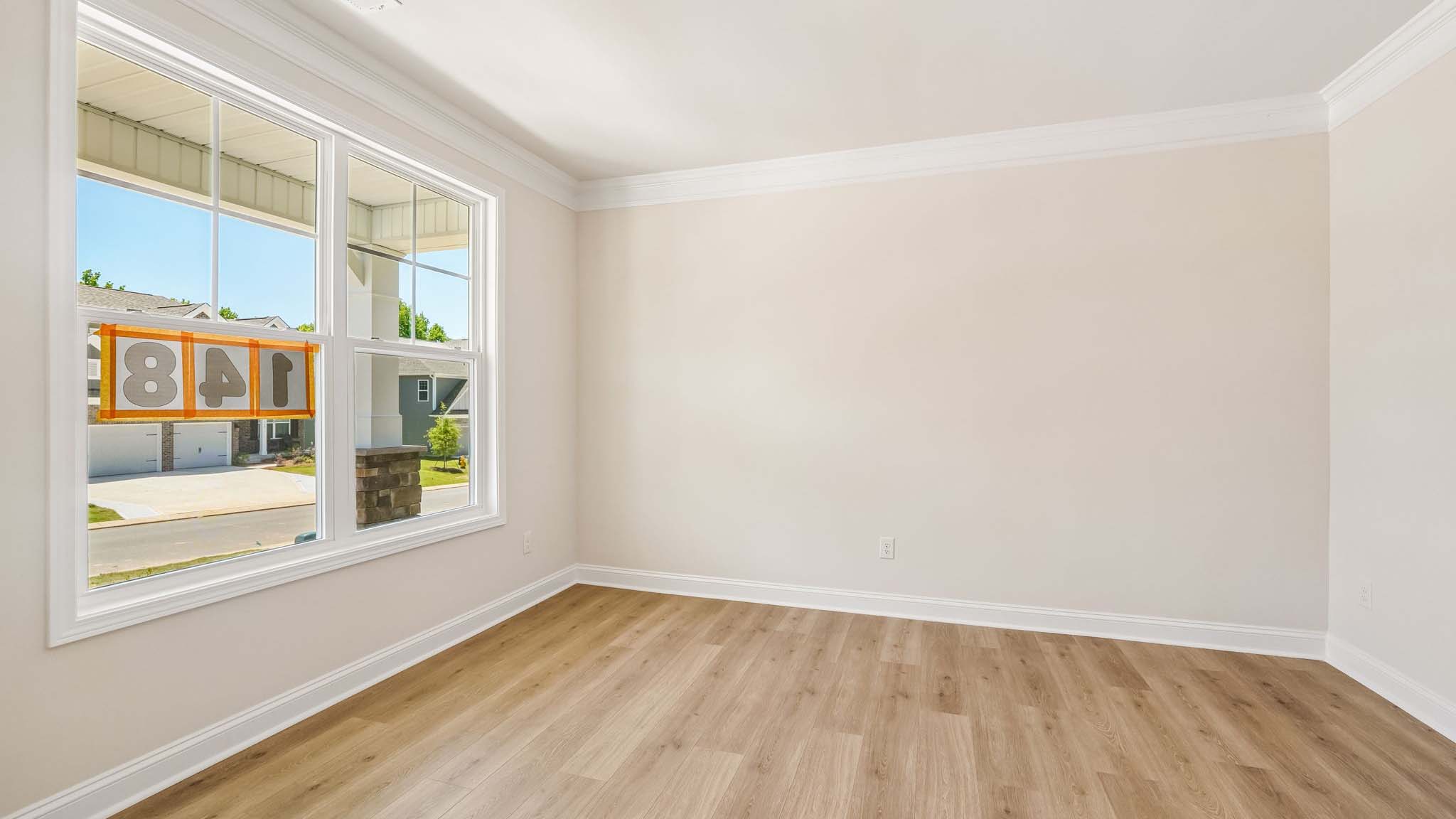 Dining room with wood floors, and large window