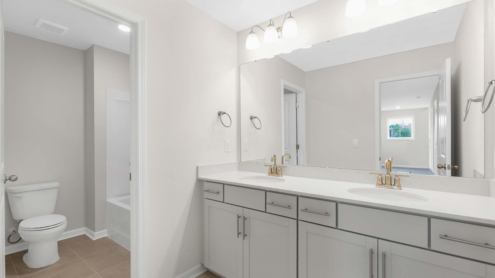 Bathroom with white cabinets