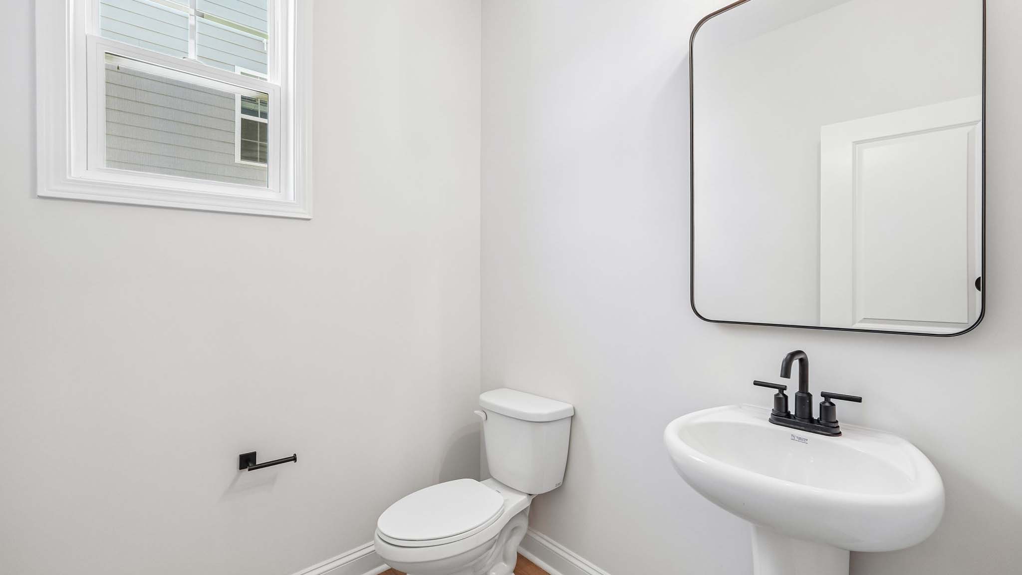 Powder bathroom with sink and toilet
