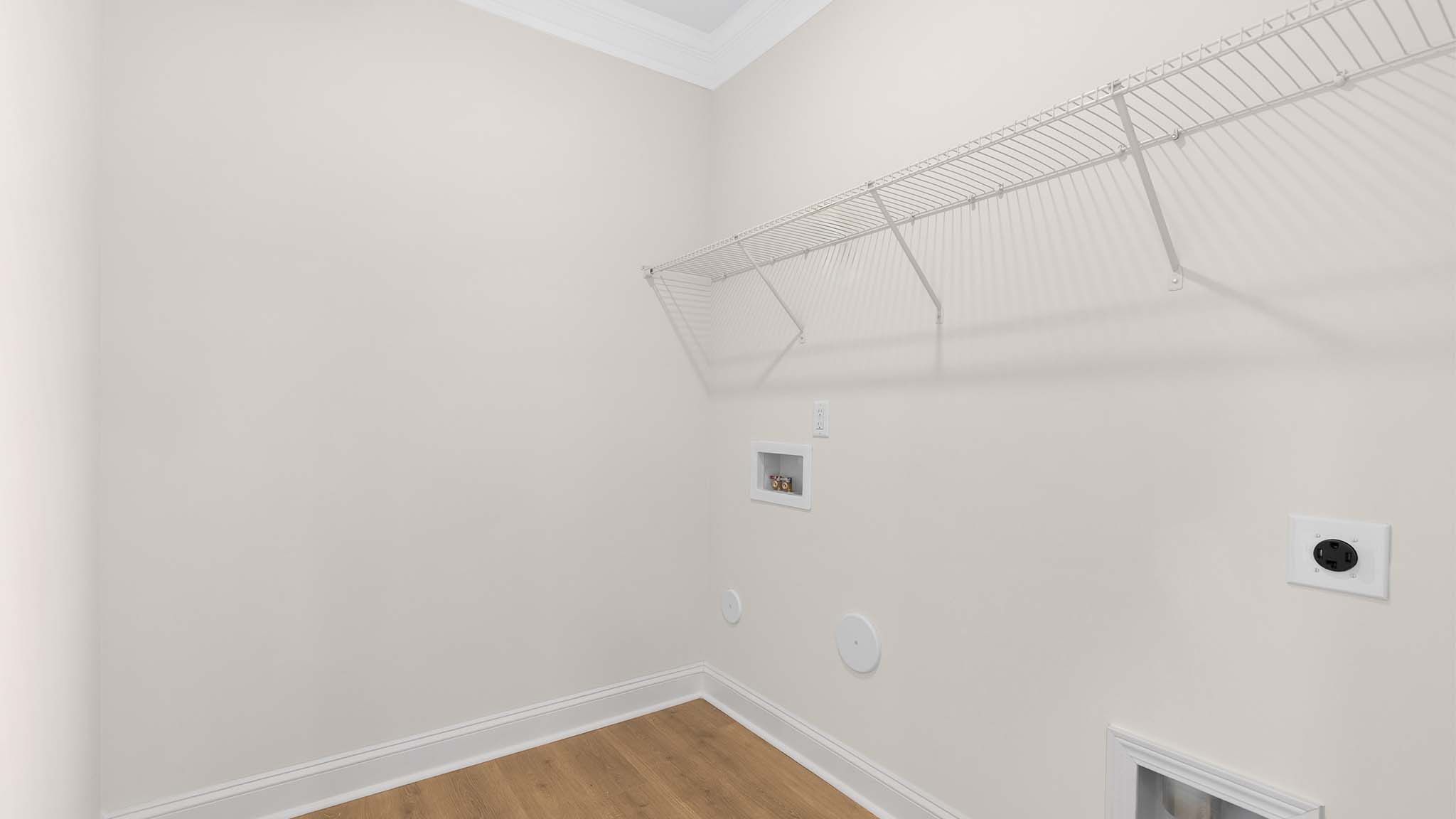 Laundry room with racks above machines for storage and hanging