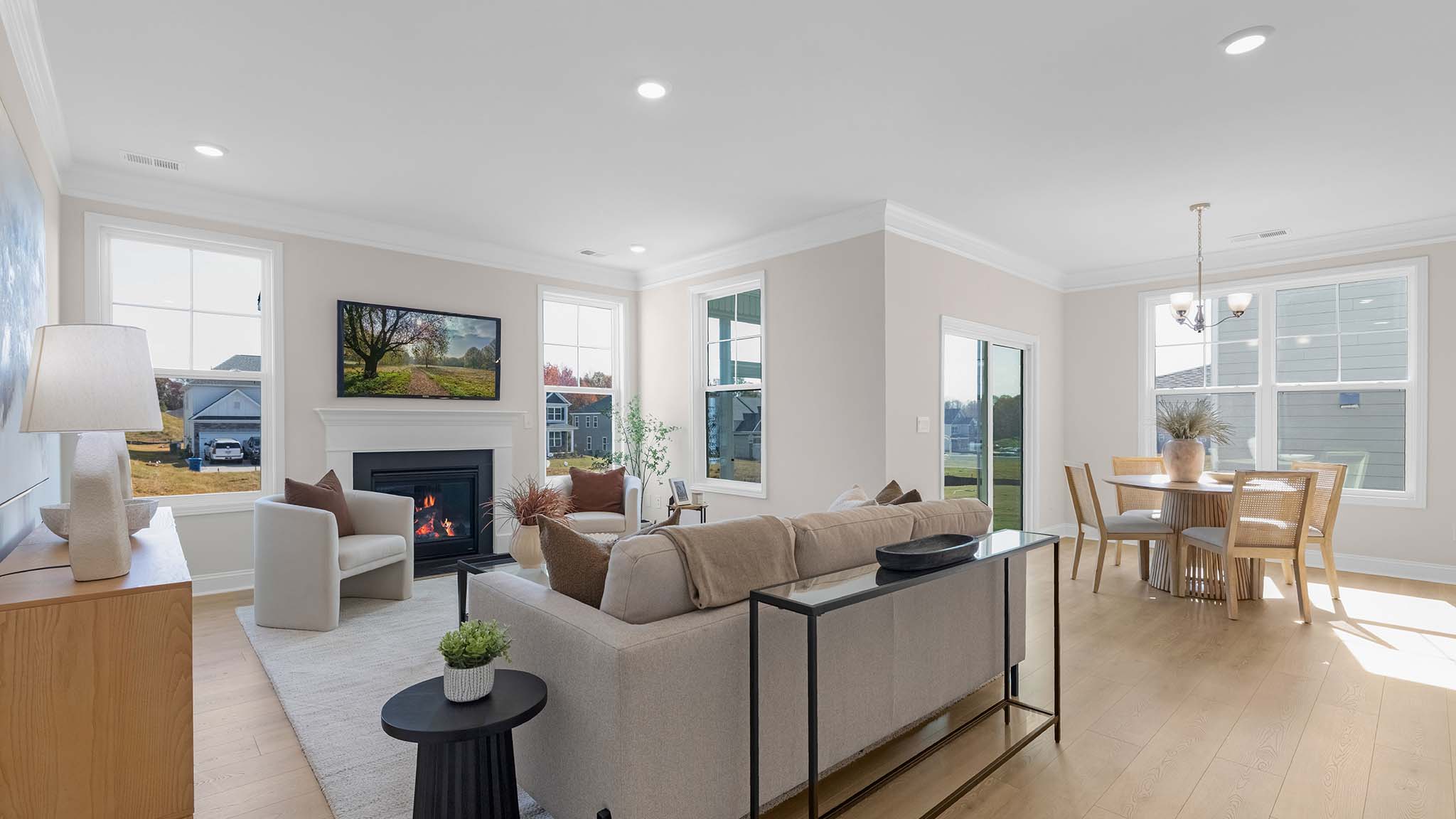 Open family room with two large window and fireplace