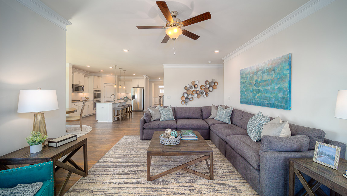 Open family room with two large window and fireplace