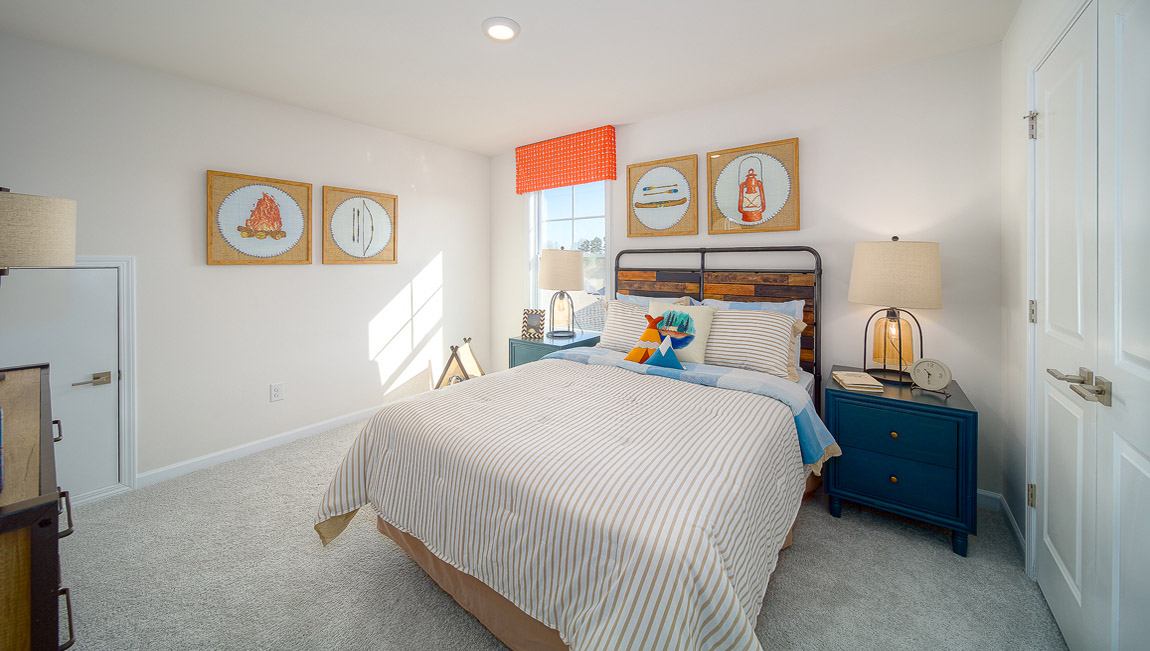 Carpeted bedroom with  small window