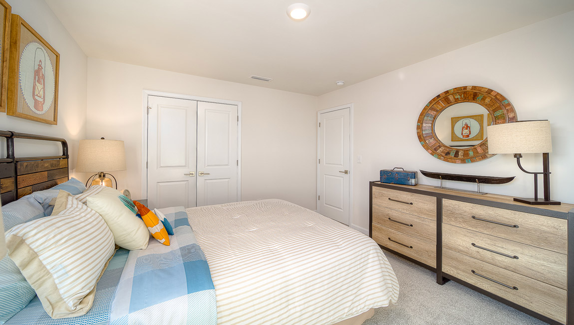 Carpeted bedroom with  small window