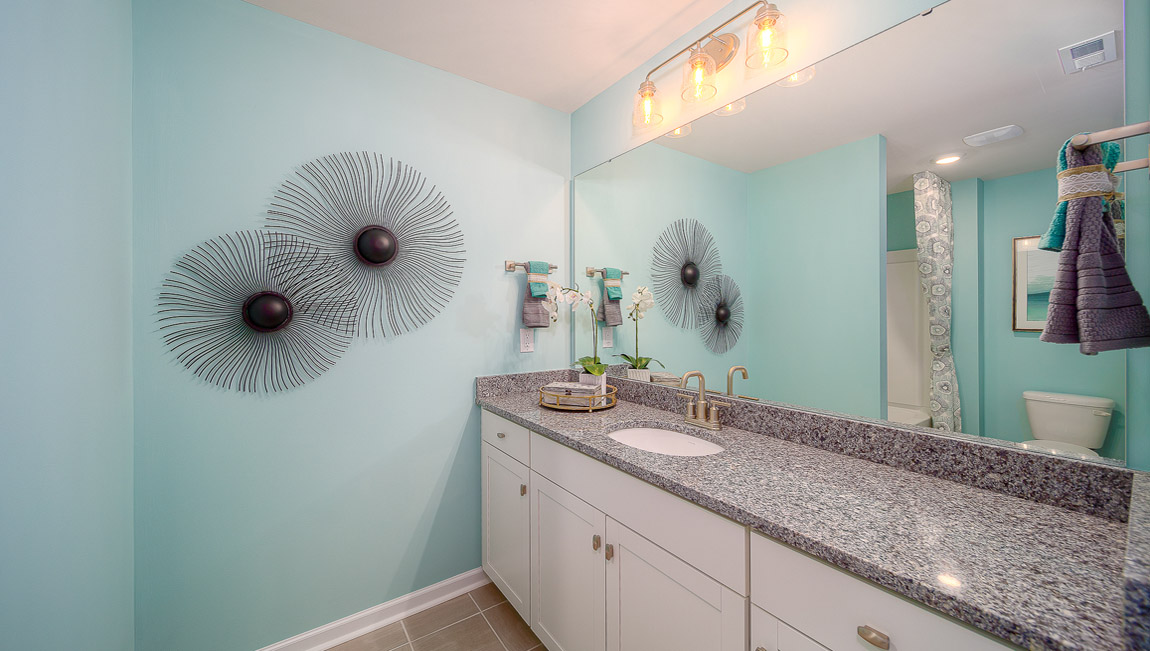 Bathroom with white cabinets