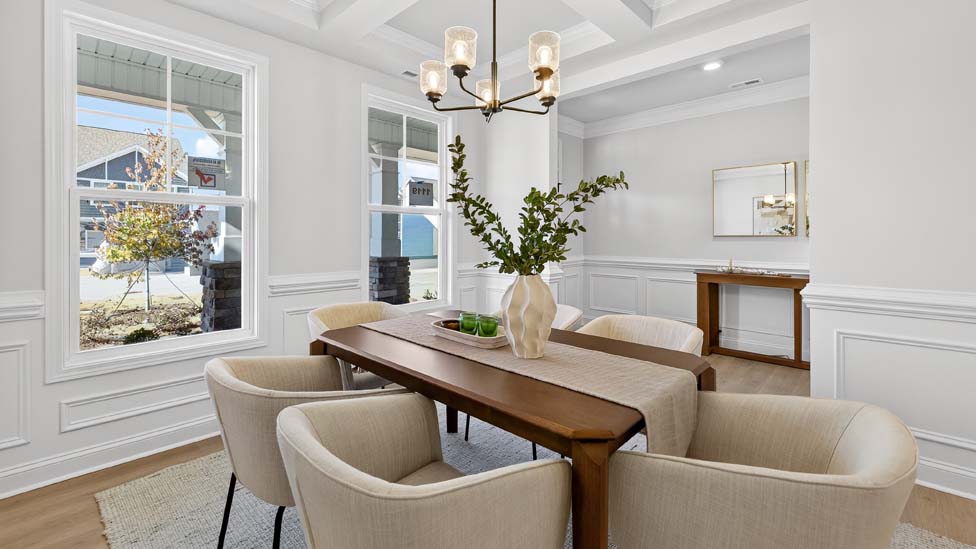 Dining room area with large windows and wood floors