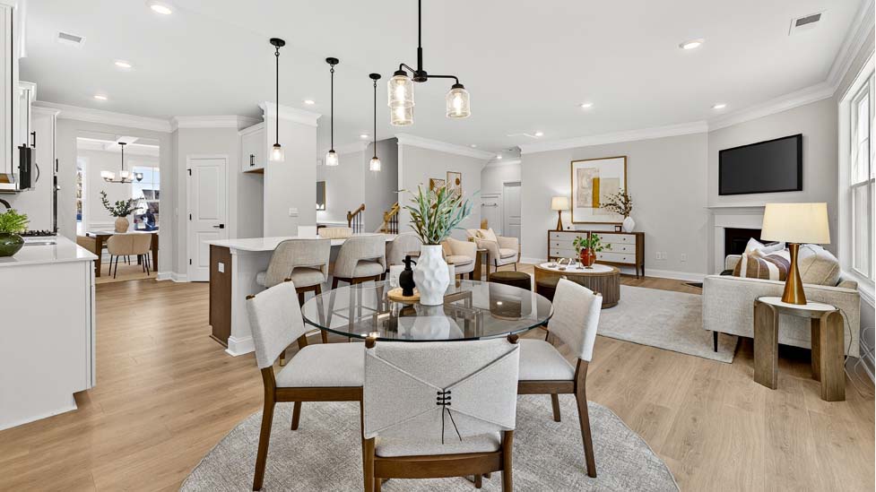 Dining room area with large windows and wood floors