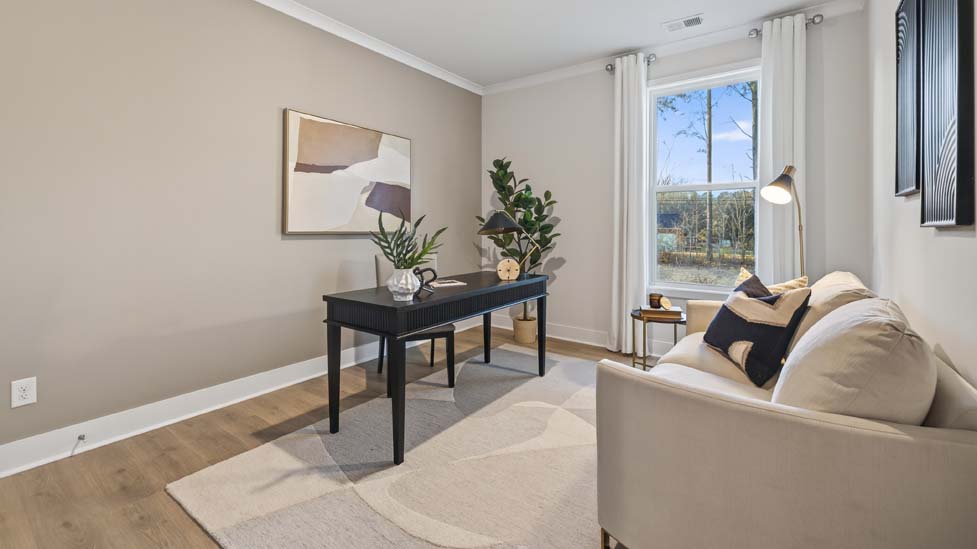 Living room area with large windows and fireplace
