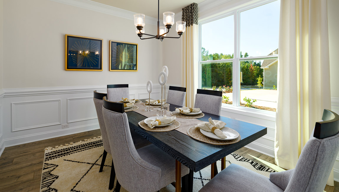 Dining room with wood floors and large window