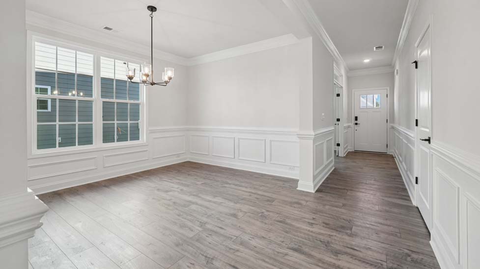 breakfast nook beside kitchen with large windows