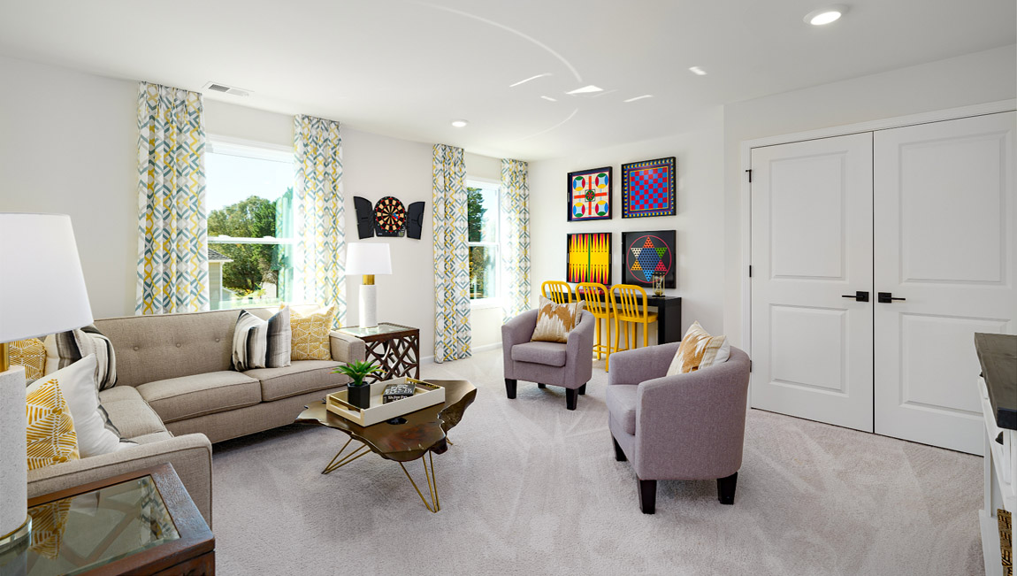 Loft space with carpet and two large windows