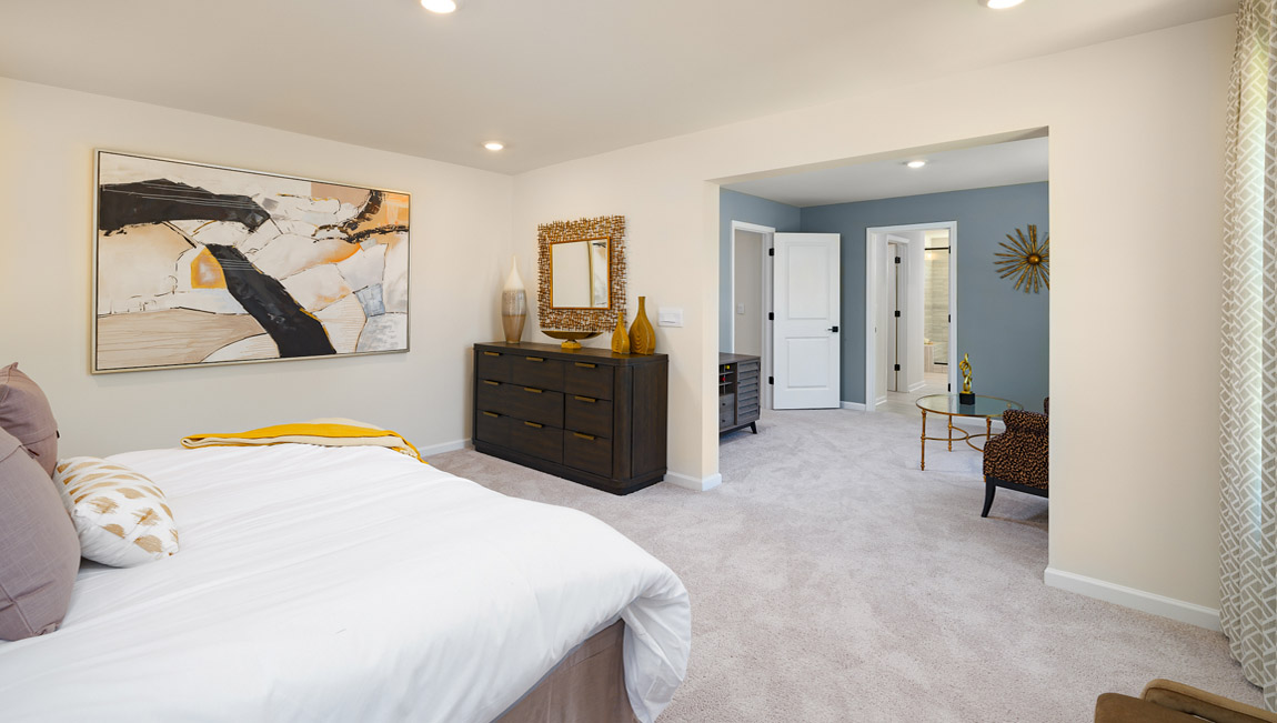 Primary bedroom, carpeted, with three windows