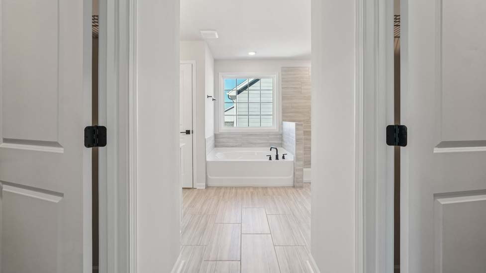 Primary bathroom with soaking tub and walk in shower