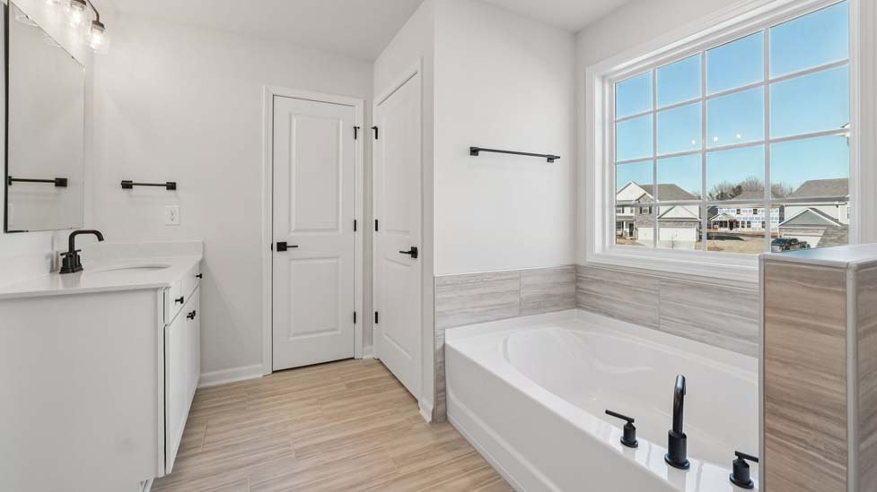 Primary bathroom with soaking tub and walk in shower