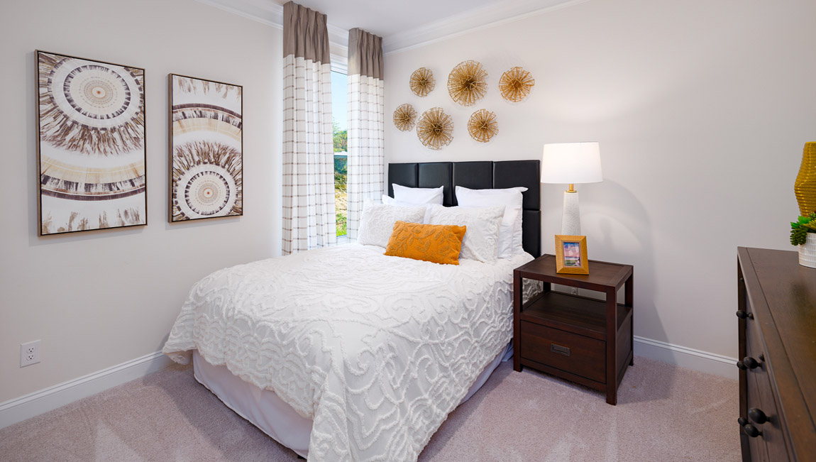 Carpeted bedroom with windows