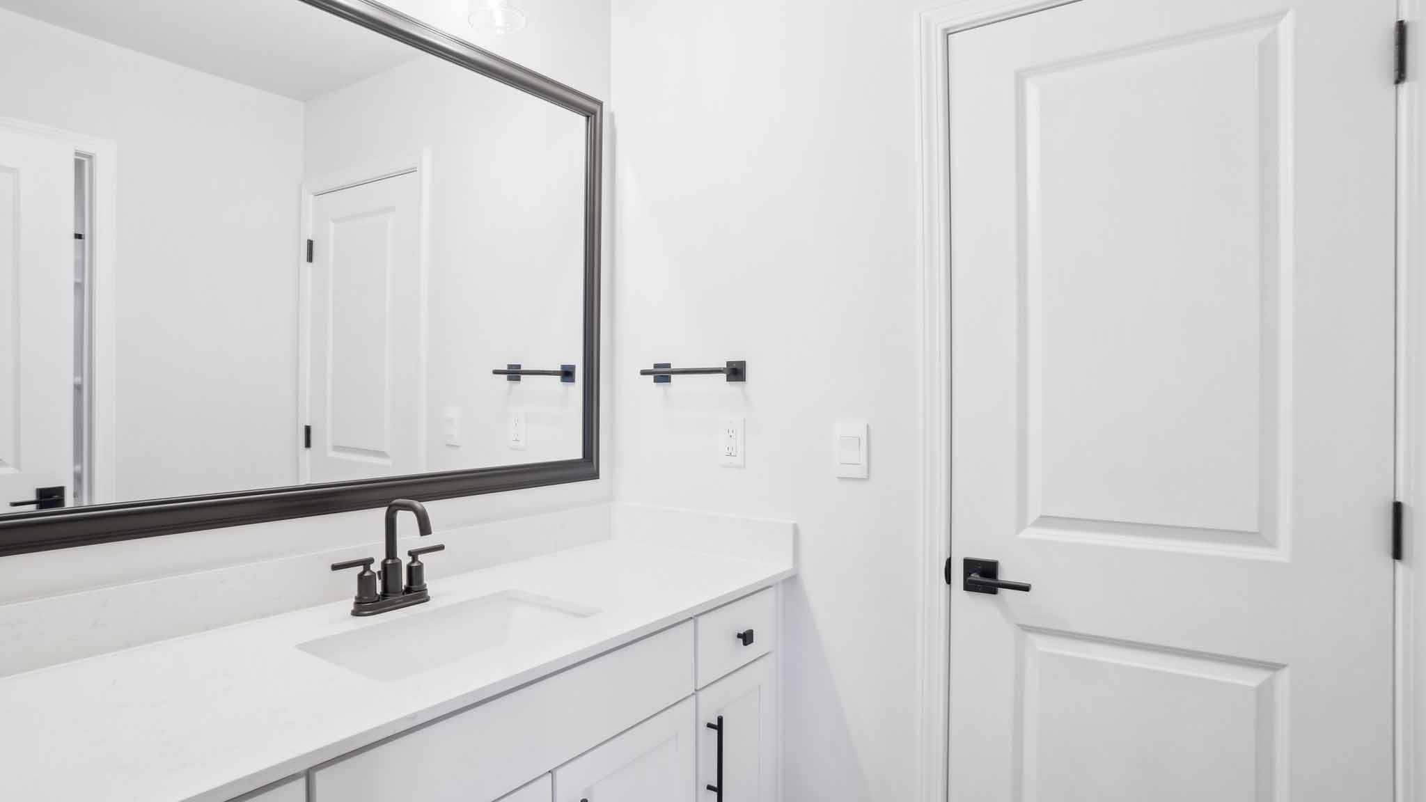 Bathroom with brown cabinets