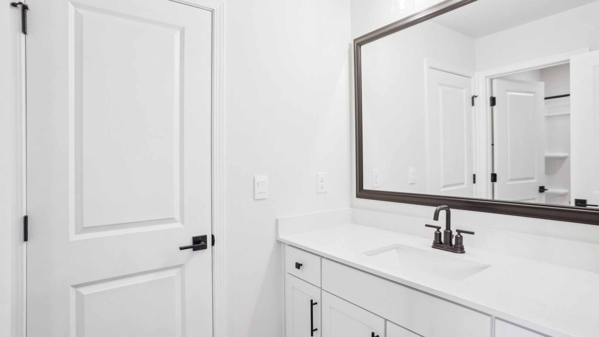 Bathroom with brown cabinets