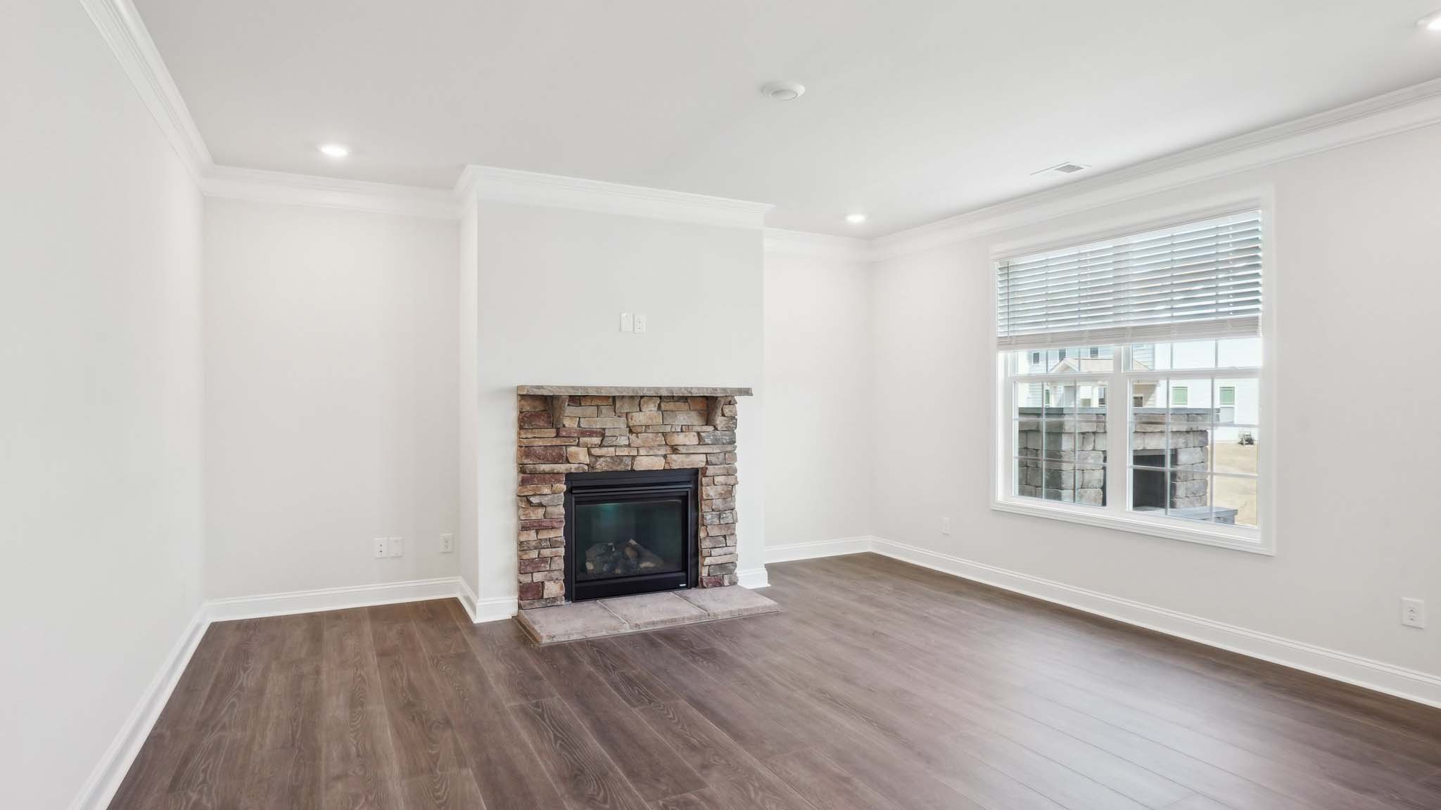 Open concept living room with large windows