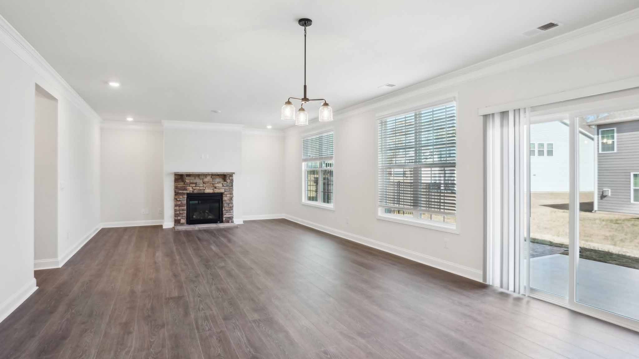 Open concept living room with large windows