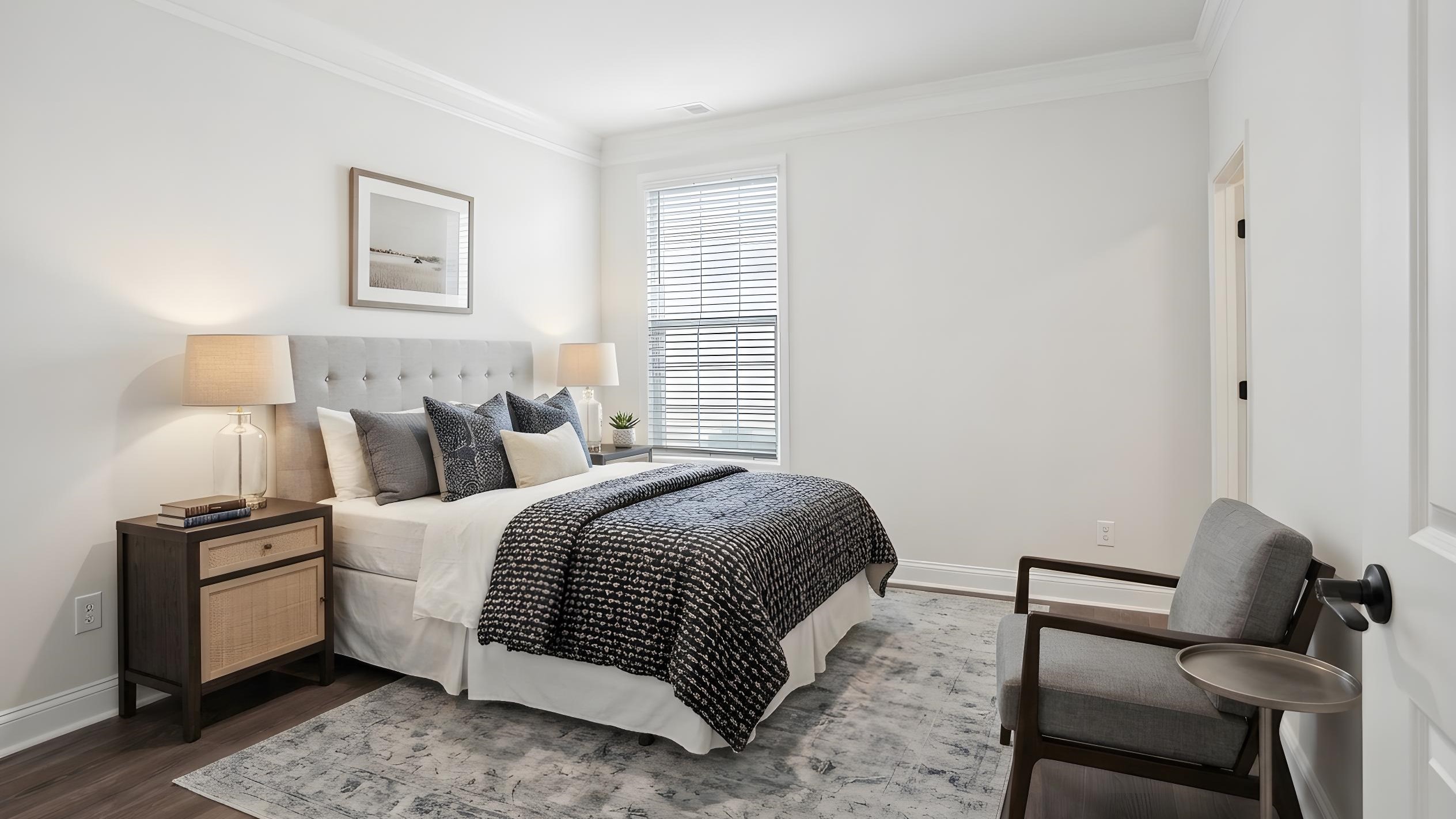 Carpeted bedroom with ceiling fan and small window