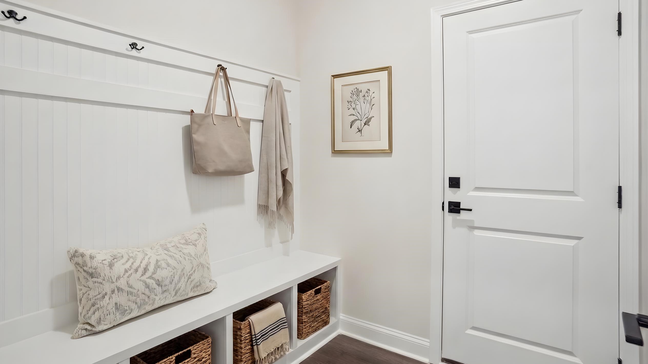 Laundry room with racks above the machines