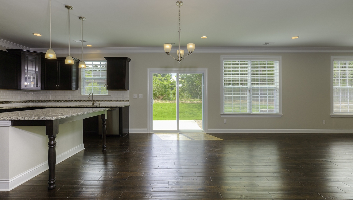 Breakfast area beside kitchen with sliding glass back doors