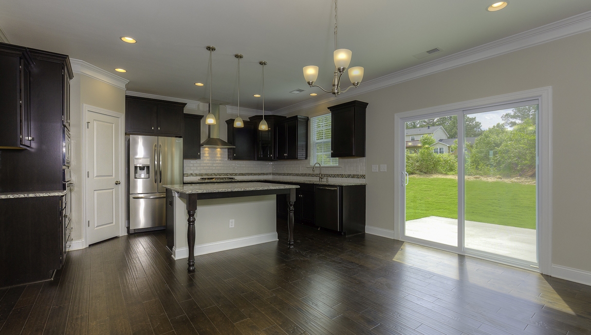 Breakfast area beside kitchen with sliding glass back doors