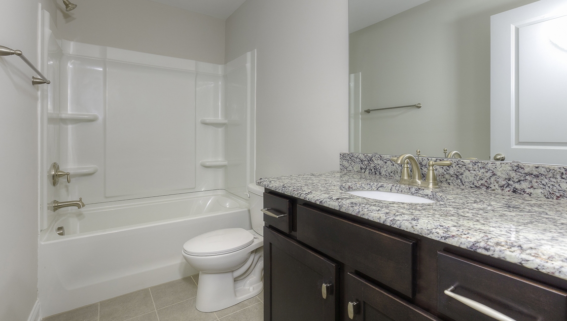 Bathroom with bathtub and shower combination