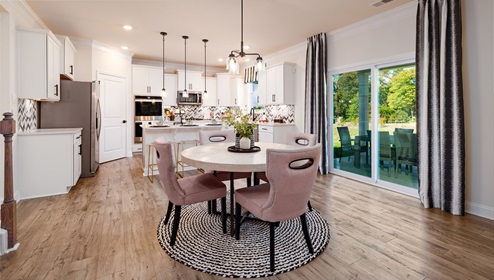 Breakfast area beside kitchen living room, and sliding glass back door