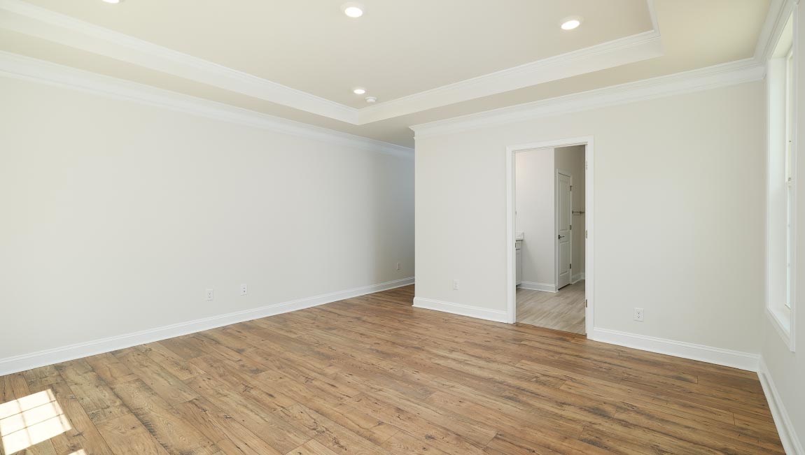 Open great room with large windows and fireplace