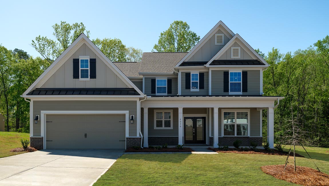 Vanderbilt two story front exterior with siding, and two car garage