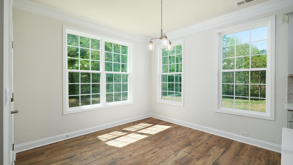 Dining room with large window, and chandelier