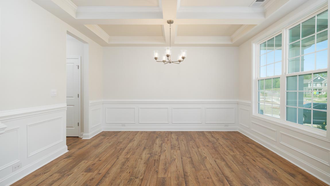Dining room with large window, and chandelier