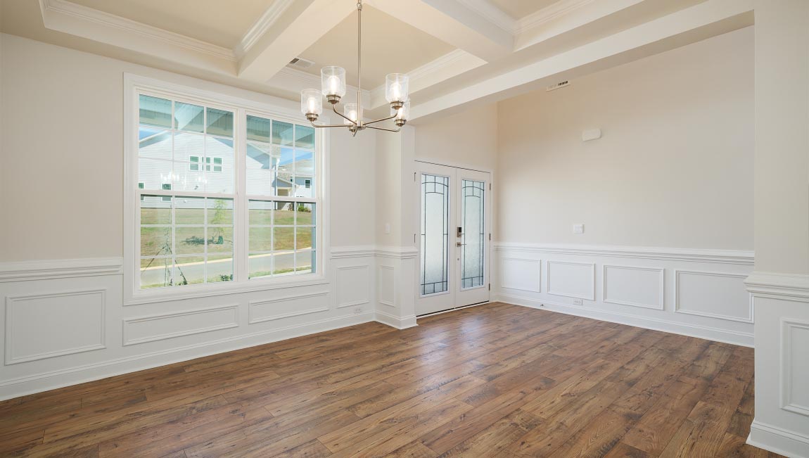 Dining room with large window, and chandelier