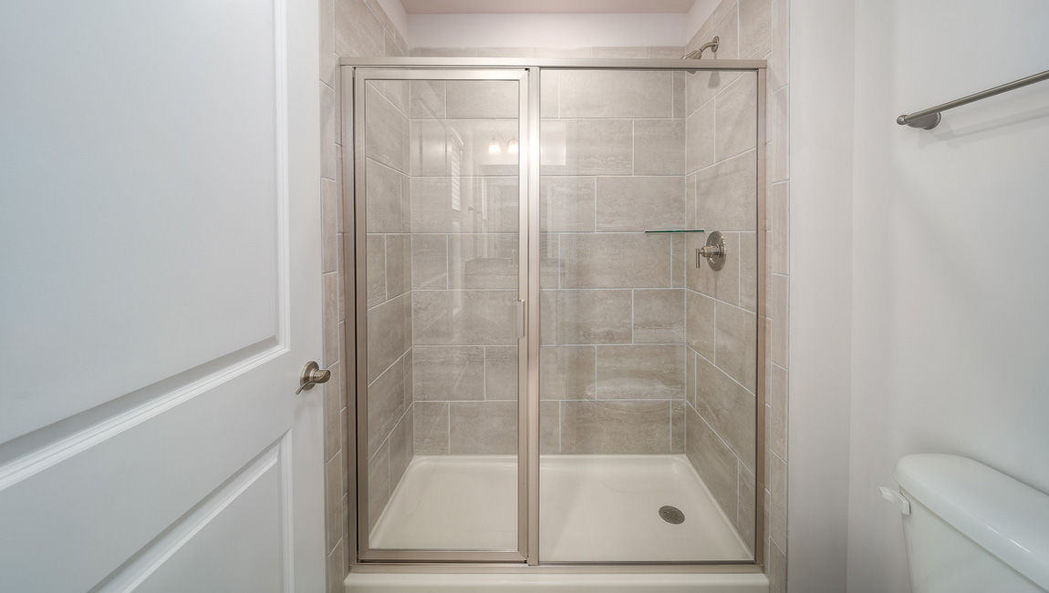 Bathroom with standing glass door shower