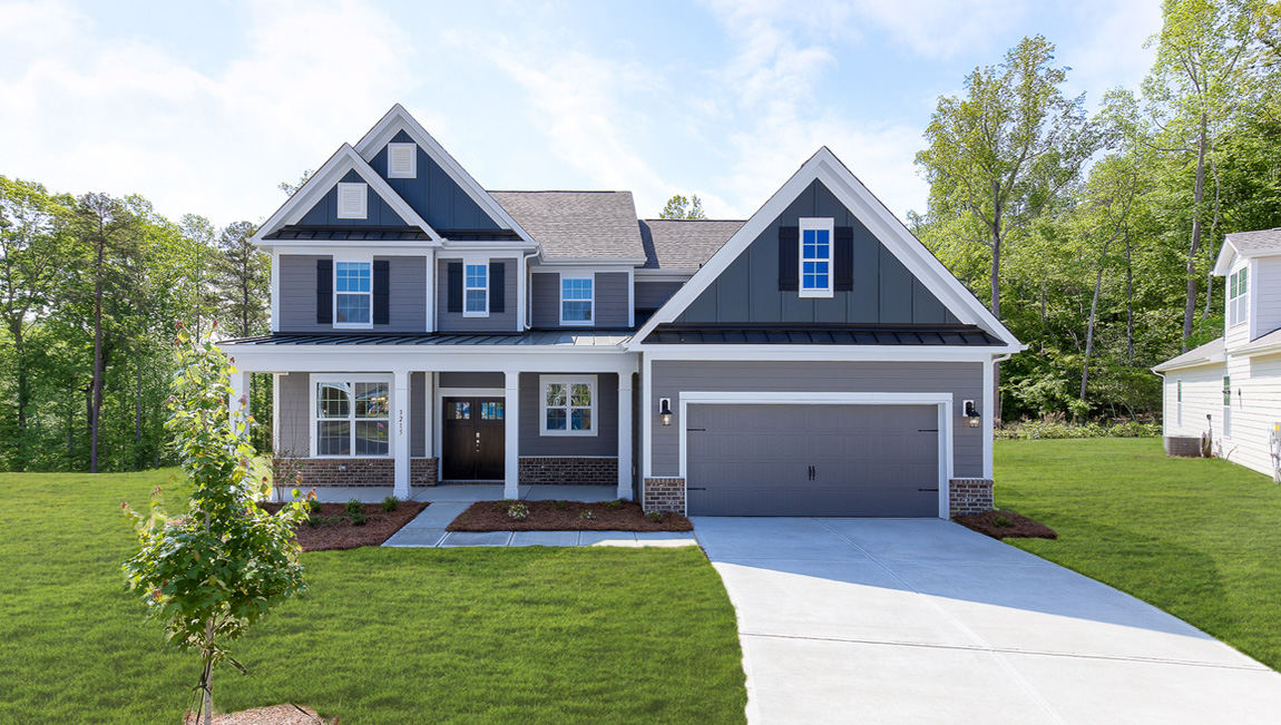 Vanderbilt two story front exterior with siding, and two car garage