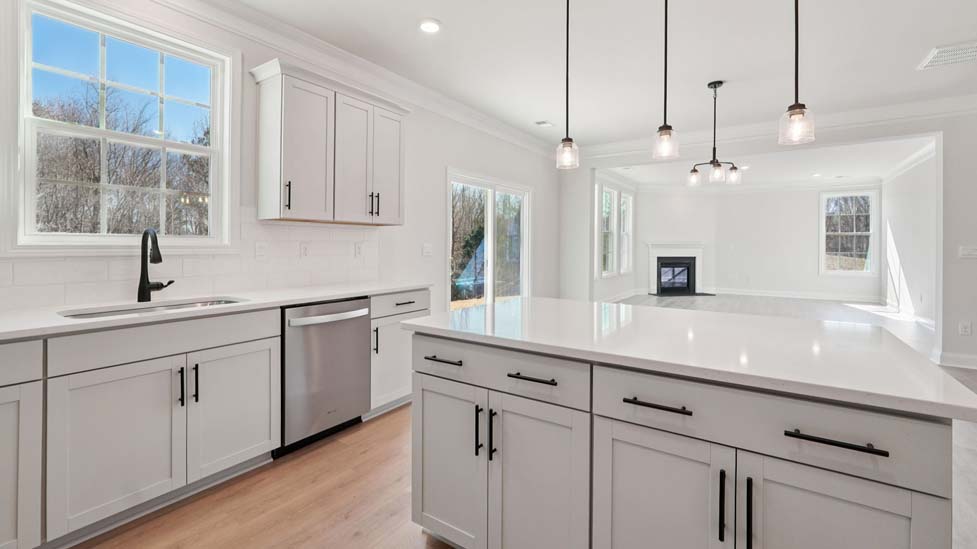 Kitchen and island with stainless steel appliances