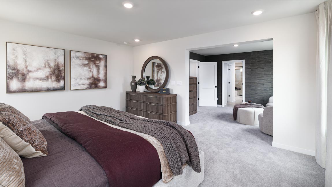 Primary bedroom, carpeted, with three windows