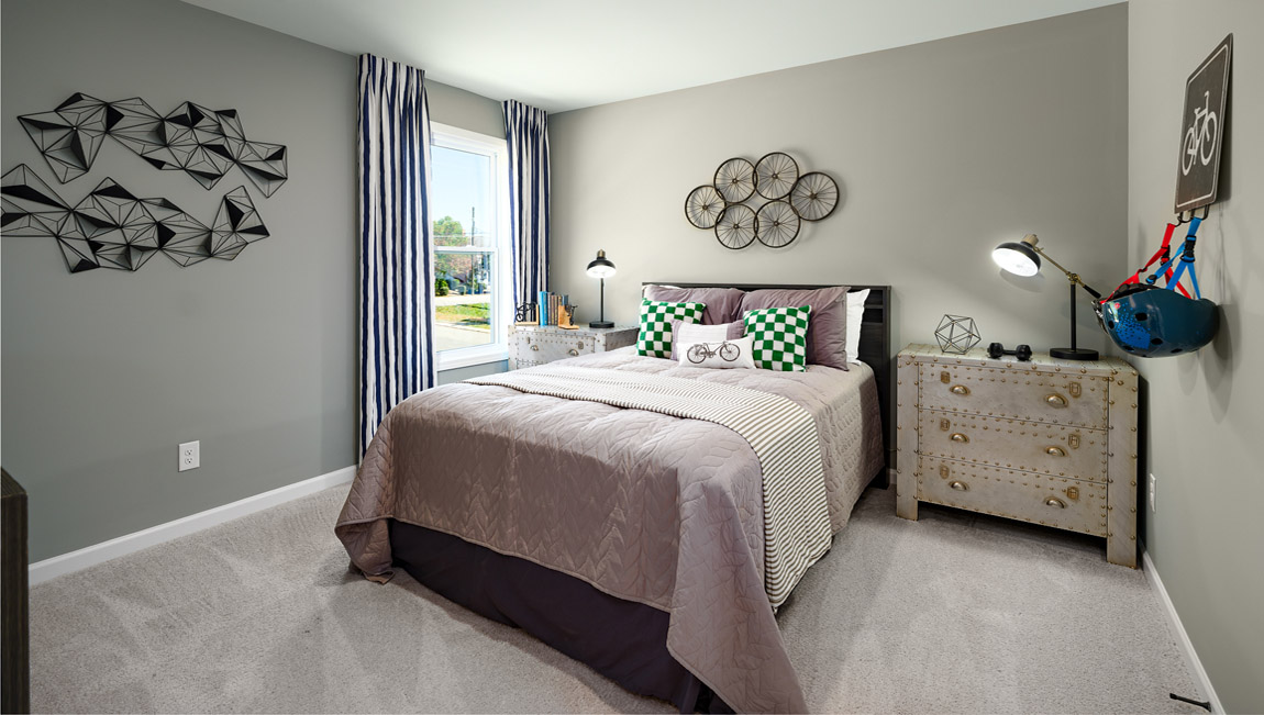 Carpeted bedroom with windows
