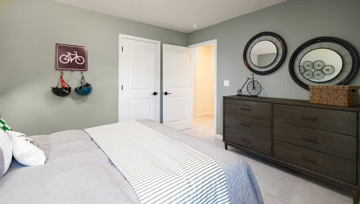 Carpeted bedroom with windows