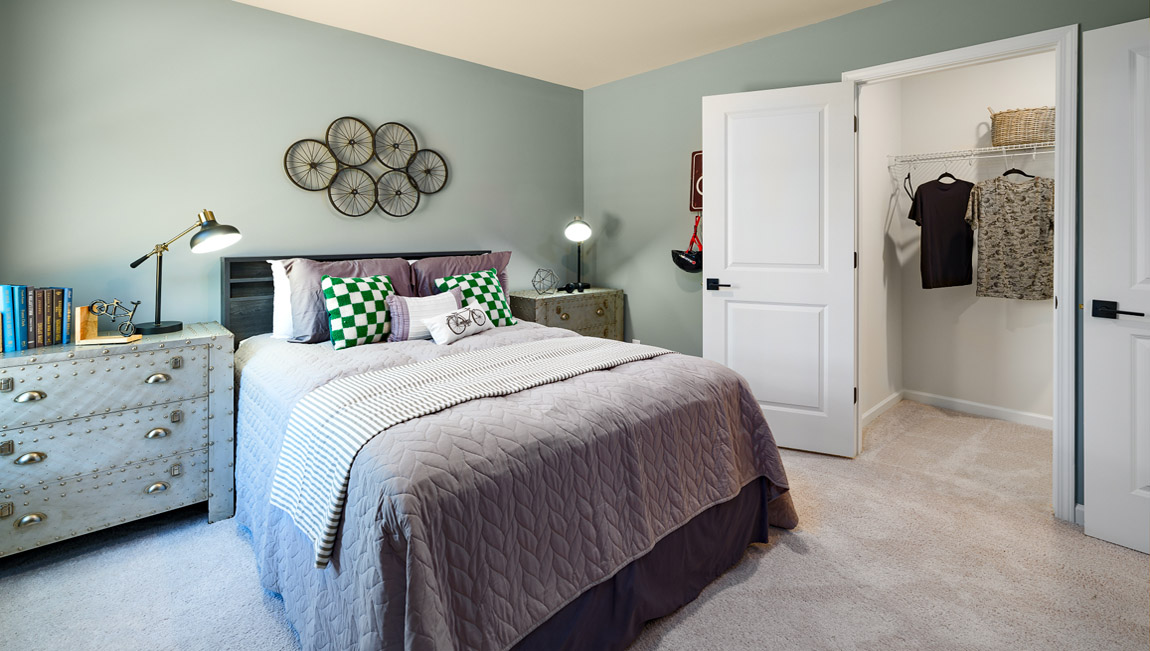 Carpeted bedroom with windows