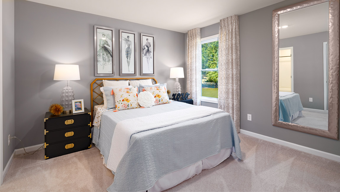 Carpeted bedroom with windows