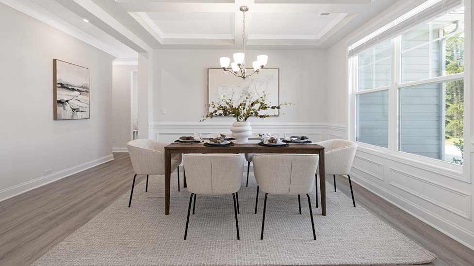 Dining room area with large windows and hanging light