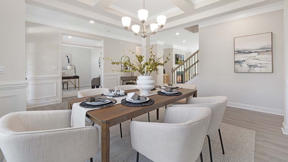 Dining room area with large windows and hanging light
