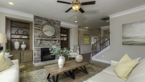 open family room with brick fireplace and large windows