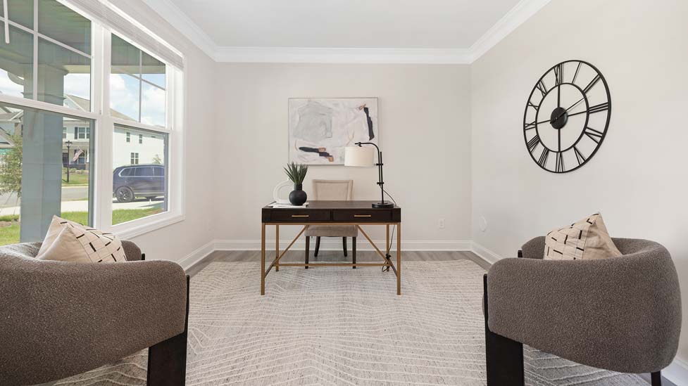 Carpeted bedroom with windows