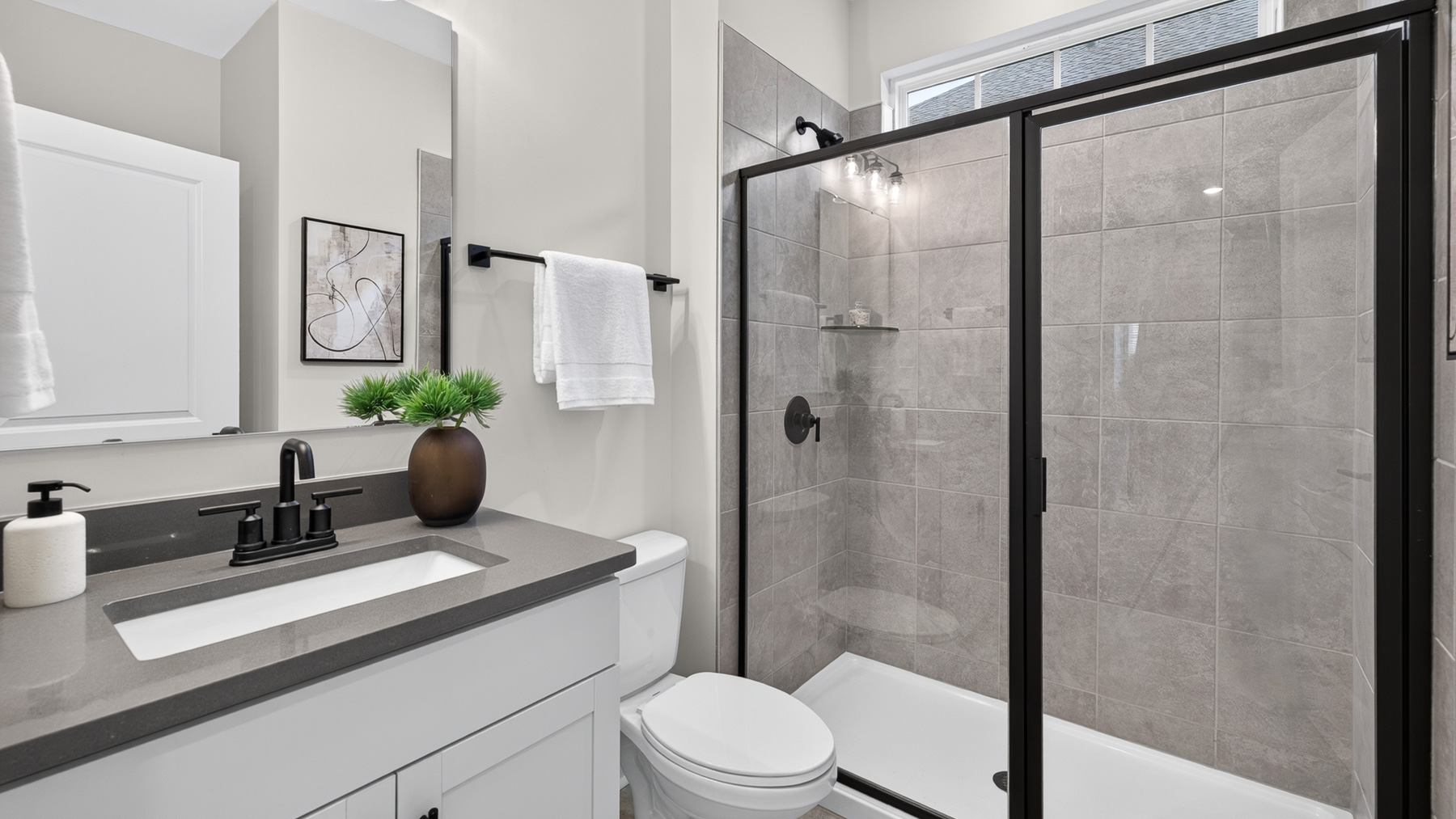 bathroom with standing glass shower