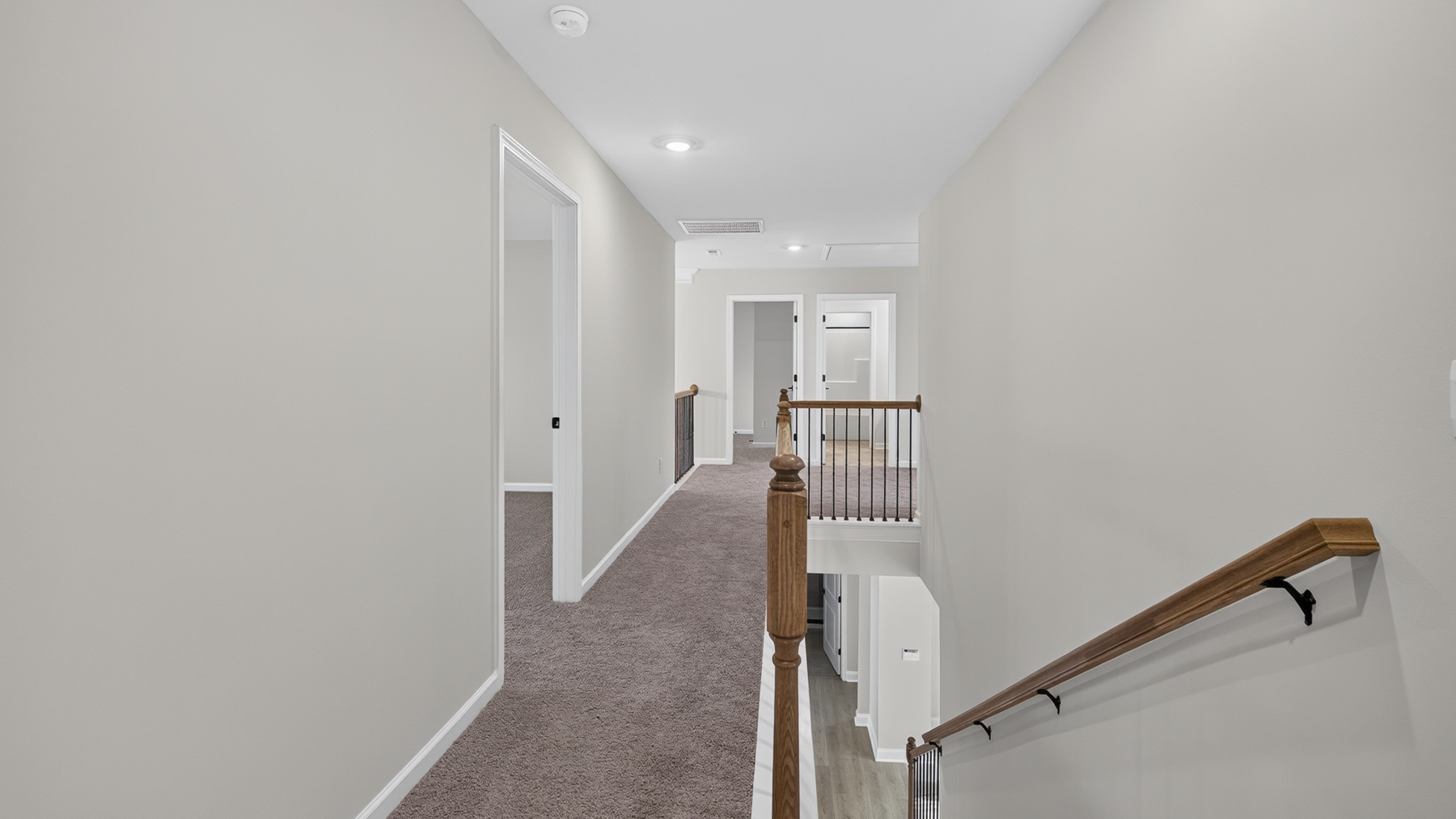 Upstairs landing area with view of stairs